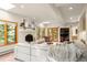 Spacious living room boasting a white fireplace, abundant natural light, and backyard access at 28890 Pinewood Vista Dr, Evergreen, CO 80439