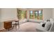 Inviting room with large windows, natural light, soft carpet, and comfortable seating, creating a relaxing atmosphere at 28890 Pinewood Vista Dr, Evergreen, CO 80439