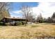 Lawn with picnic table, hedges, and mature trees at 5200 W Ottawa Ave, Littleton, CO 80128