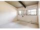 Bedroom with carpet and exposed wood beam on ceiling at 5200 W Ottawa Ave, Littleton, CO 80128