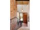 Charming entryway with brick wall, tile flooring, and wooden door at 5200 W Ottawa Ave, Littleton, CO 80128