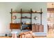 Stylish living room featuring built-in shelving and dining nook at 5200 W Ottawa Ave, Littleton, CO 80128