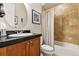 Bathroom featuring a wooden vanity and a tub with a patterned shower curtain at 40 Madison St # 203, Denver, CO 80206