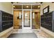 Well-lit condo entryway with mailboxes and secure access, ensuring convenience for residents at 40 Madison St # 203, Denver, CO 80206
