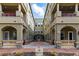 Beautiful condo exterior featuring a courtyard with attractive architectural details and a welcoming entrance at 40 Madison St # 203, Denver, CO 80206