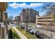 Beautiful view of the building with many balconies from an elevated position, showing the surrounding neighborhood at 40 Madison St # 203, Denver, CO 80206