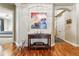 Elegant foyer featuring hardwood floors, a charming display table, and an open doorway at 40 Madison St # 203, Denver, CO 80206