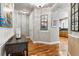 Lovely foyer featuring hardwood floors, elegant lighting, and tasteful decor creating an inviting ambiance at 40 Madison St # 203, Denver, CO 80206