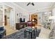Bright living room featuring neutral walls, blue accent rug, and dark wood furniture at 40 Madison St # 203, Denver, CO 80206