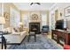 Bright living room featuring neutral walls and furniture, a fireplace, and blue accent rug at 40 Madison St # 203, Denver, CO 80206