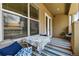 Cozy covered patio with seating, a patterned rug, and natural light, perfect for relaxing outdoors at 40 Madison St # 203, Denver, CO 80206