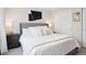 Bright bedroom with a comfortable bed, stylish decor, and a closet with sliding doors at 1284 Quitman St, Denver, CO 80204