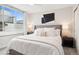 Bright bedroom with a large window, a comfortable bed, and stylish decor at 1284 Quitman St, Denver, CO 80204