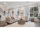 Inviting living room featuring a large sectional sofa and a stylish rug at 1284 Quitman St, Denver, CO 80204