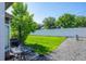 Fenced backyard with manicured lawn, table and chairs, and barbeque at 5415 W 16Th Ave, Lakewood, CO 80214
