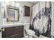 Clean bathroom with modern vanity, mountain scene shower curtain, and sleek fixtures at 5415 W 16Th Ave, Lakewood, CO 80214