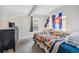 Bedroom with dark furniture, Colorado flag and sloped ceiling at 5415 W 16Th Ave, Lakewood, CO 80214