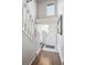 Bright entryway with tile flooring, a staircase, and a welcoming white door, showcasing a clean and modern design at 5415 W 16Th Ave, Lakewood, CO 80214