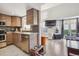 Bright kitchen with stainless steel appliances, tile backsplash, and opens to the living room at 5415 W 16Th Ave, Lakewood, CO 80214