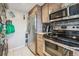 Updated kitchen features stainless steel appliances and sleek countertops at 5415 W 16Th Ave, Lakewood, CO 80214