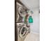 A practical laundry room with stacked washer and dryer, optimizing space at 5415 W 16Th Ave, Lakewood, CO 80214