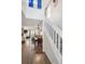 An open living space with hardwood floors, a dining area, and a view to the exterior at 5415 W 16Th Ave, Lakewood, CO 80214