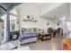 Cozy living room with a gray sofa, dining area, and a view of the outdoor patio at 5415 W 16Th Ave, Lakewood, CO 80214