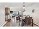 Open-concept living area with hardwood floors, a bay window, and a seamless flow to the kitchen at 5415 W 16Th Ave, Lakewood, CO 80214