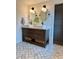 Bathroom with a double sink vanity, decorative mirrors, and herringbone tile floors for an elegant and modern feel at 8503 E Jamison Ave, Centennial, CO 80112