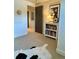 Spare bedroom with carpeted floors, neutral walls, and a collection of books on a decorative shelf at 8503 E Jamison Ave, Centennial, CO 80112