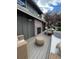 Outdoor deck featuring a brick fireplace and plenty of seating perfect for entertaining guests at 8503 E Jamison Ave, Centennial, CO 80112