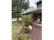 Charming front yard with lush landscaping, mulch beds, and a brick facade at 8503 E Jamison Ave, Centennial, CO 80112