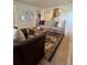 Inviting living room with hardwood floors, cozy seating, and decorative rug at 8503 E Jamison Ave, Centennial, CO 80112