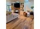 Cozy living room with fireplace, skylights, built-in shelves, wood floors, and stylish decor at 8503 E Jamison Ave, Centennial, CO 80112