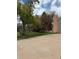 Wide shot of a spacious yard featuring lush green grass and a variety of trees at 8503 E Jamison Ave, Centennial, CO 80112