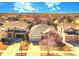 Aerial view of a home showcasing its roof, driveway, and surrounding neighborhood at 12948 E 106Th Way, Commerce City, CO 80022