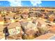 Expansive aerial view showcasing a neighborhood's layout, homes, and streets at 12948 E 106Th Way, Commerce City, CO 80022