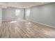 Spacious basement with vinyl plank flooring and natural light at 12948 E 106Th Way, Commerce City, CO 80022