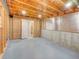 Unfinished basement with exposed wood ceiling, gray concrete floor and open door to stairs at 12948 E 106Th Way, Commerce City, CO 80022