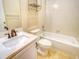 Neat bathroom with tile floor and shower-tub combo, with vanity sink, and a mirror at 12948 E 106Th Way, Commerce City, CO 80022