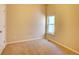 Simple bedroom featuring neutral carpet, and a bright window at 12948 E 106Th Way, Commerce City, CO 80022