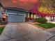 Charming home with a well-manicured lawn, brick accents, and a two-car garage at 12948 E 106Th Way, Commerce City, CO 80022