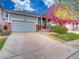 Charming home featuring a well-kept front yard and covered porch with brick columns and a two-car garage at 12948 E 106Th Way, Commerce City, CO 80022