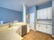 Functional kitchen with light countertops, tile backsplash, and stainless steel dishwasher at 12948 E 106Th Way, Commerce City, CO 80022