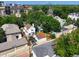 Scenic aerial view of a residential neighborhood with lush trees and charming homes at 160 Monroe St, Denver, CO 80206