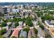 Expansive aerial view of the neighborhood showing diverse housing and city skyline at 160 Monroe St, Denver, CO 80206