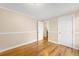 Bright bedroom features a hardwood floor and neutral walls, perfect for relaxation and rest at 8512 W Star Cir, Littleton, CO 80128
