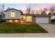 Charming home with a well-manicured lawn and lovely landscaping at 8512 W Star Cir, Littleton, CO 80128