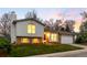 Charming two-story home featuring brick accents and a well-maintained front lawn at 8512 W Star Cir, Littleton, CO 80128