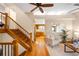 Inviting living room with hardwood floors, a staircase, and natural light at 8512 W Star Cir, Littleton, CO 80128